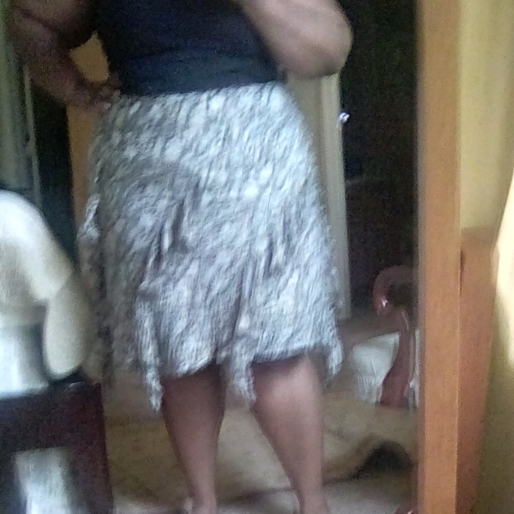 handkerchief hem brown, cream, and blue skirt